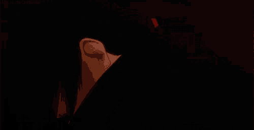 a close up of a person 's eyes with red lights coming out of them