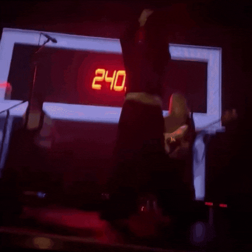 a clock displays the time as 2:40 in red