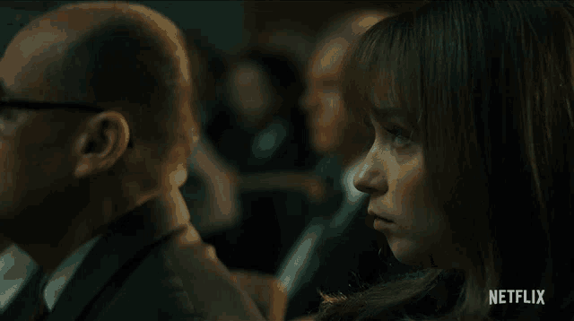 a netflix ad shows a woman sitting in a crowd