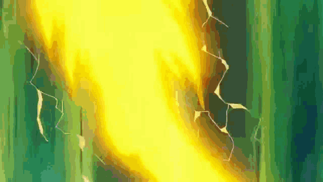 a close up of a fire with a green background and a crack in it .