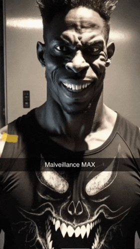 a man is wearing a black shirt with a skull on it and the caption malveillance max