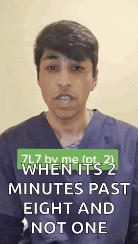 a man is standing in front of a sign that says 7l7 by me when it 's 2 minutes past eight and not one