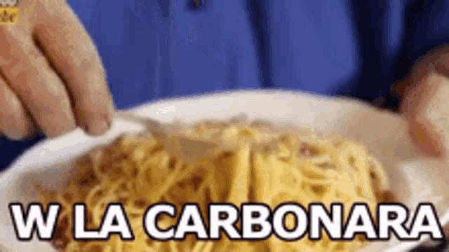 a person is holding a fork over a plate of spaghetti with the words w la carbonara written on it .