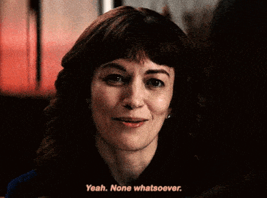 a woman says yeah none whatsoever and smiles