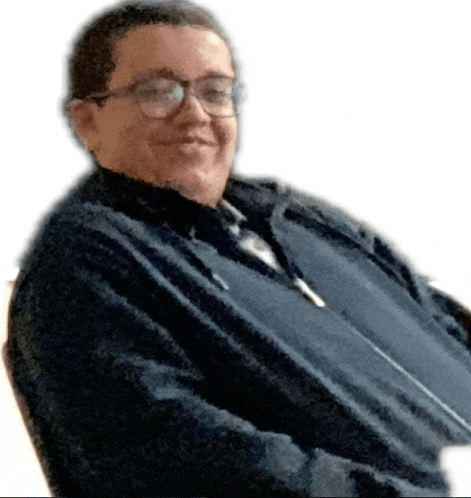 a man wearing glasses and a black jacket smiles