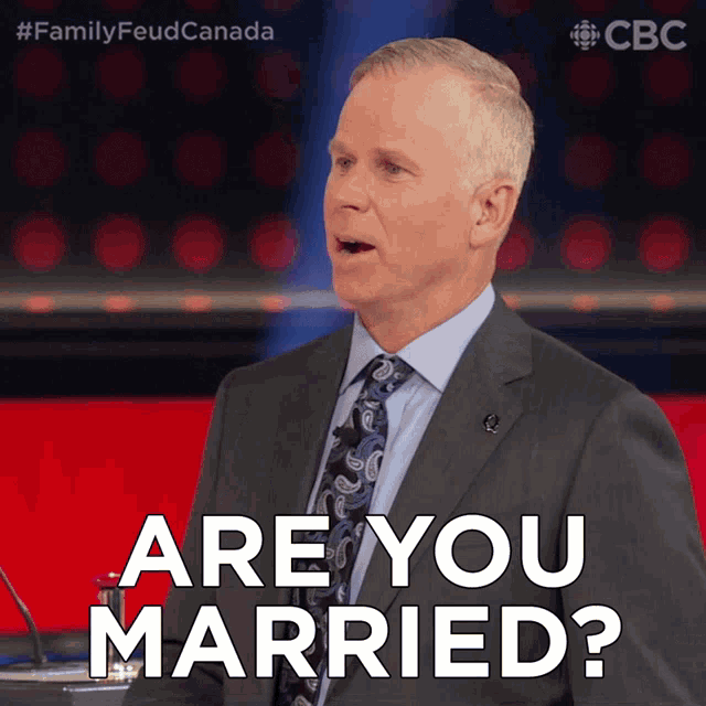 a man in a suit and tie asks are you married