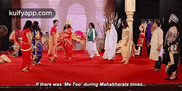 a group of people are standing on a red carpet and one of them is saying if there was me too during mahabharata times .