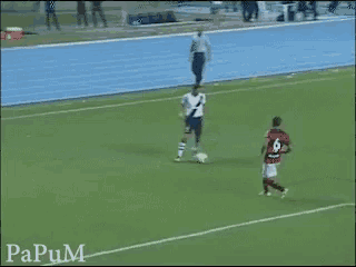 a soccer player wearing a number 6 jersey kicks the ball