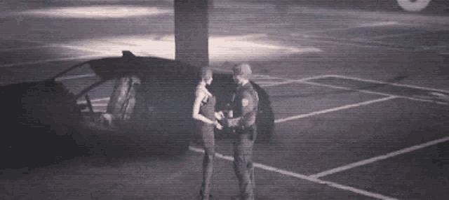 a police officer and a woman are standing in a parking lot .