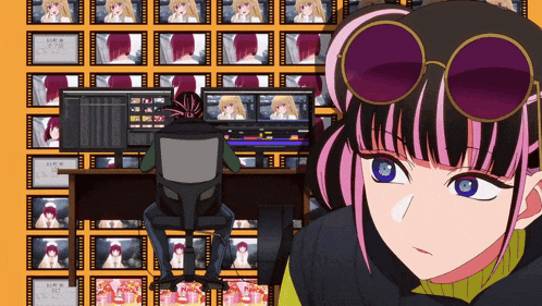 a girl wearing sunglasses looks at the camera while a man sits at a desk in front of many monitors
