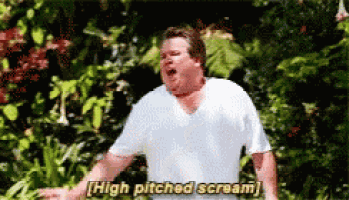 a man in a white shirt is screaming and saying high pitched scream .