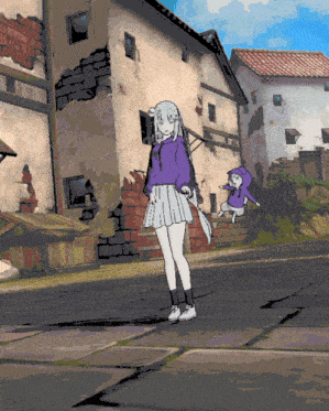 a girl in a purple hoodie is standing on a street