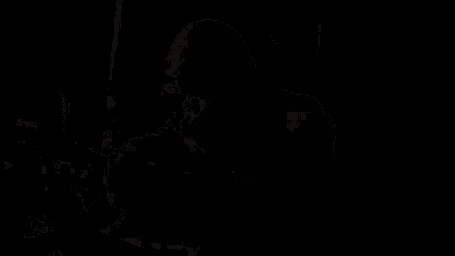 a man in a black mask is sitting on a motorcycle