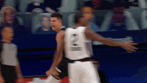 a basketball player wearing a white jersey with the number 21 on the back