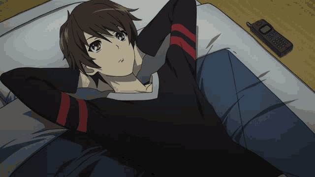 a person laying on a bed next to a remote control that has the number 0 on it