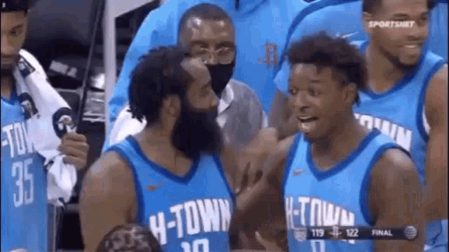 a group of basketball players are wearing h-town jerseys