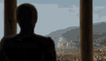 a woman looks out a window at a green explosion