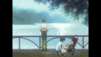 a man and a woman are looking at a body of water