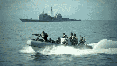 a group of soldiers in a boat in the ocean