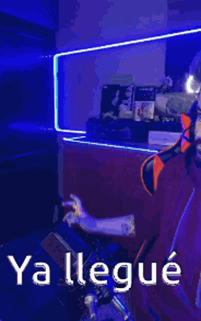 a man wearing headphones is sitting in front of a microphone in a room .