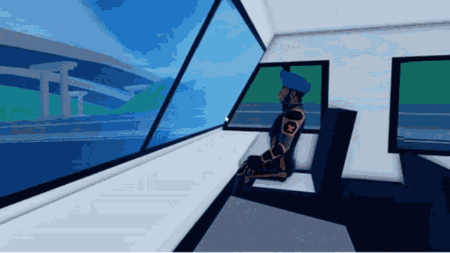 a man in a blue hat sits in a chair looking out a window