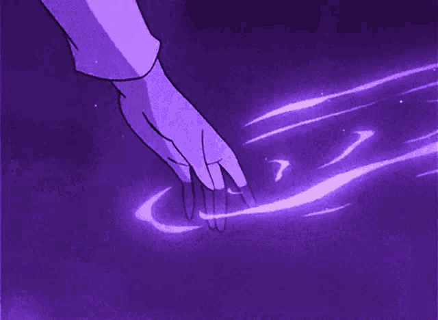 a person 's hand is touching a purple object with a purple background .