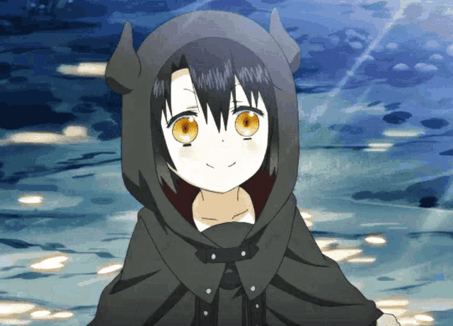 a girl with horns on her head is wearing a cape