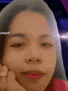 a close up of a woman 's face with a watermark that says ' urgan ' on it