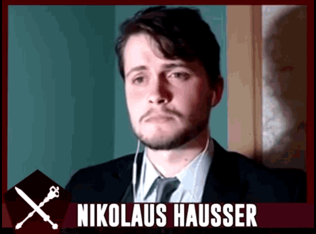 a man in a suit and tie with the name nikolaus hauser written on the bottom