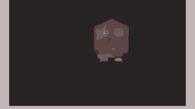 a rat is walking on a black surface in the dark .