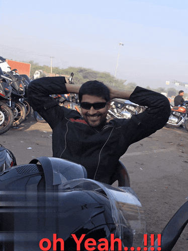 a man sitting in front of a row of motorcycles with the caption oh yeah