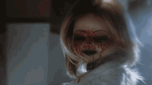 a doll with blood coming out of her mouth