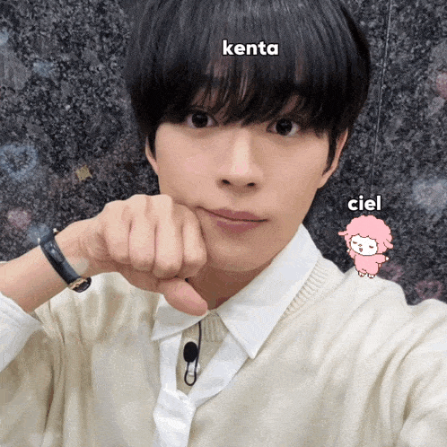 a young man with the name kenta written on his forehead