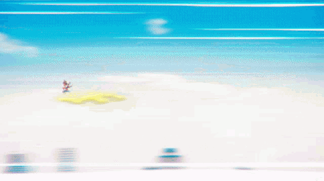a blurred image of a person on a small island in the middle of the ocean