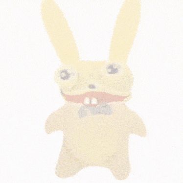 a stuffed animal with a purple bow tie and big eyes
