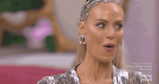 a woman wearing a headband with the words glam on it