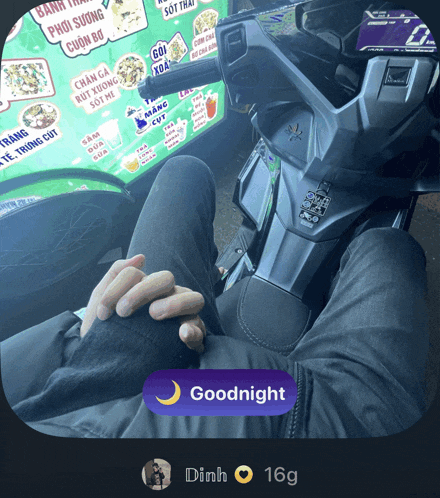 a person is sitting on a motorcycle with a goodnight button