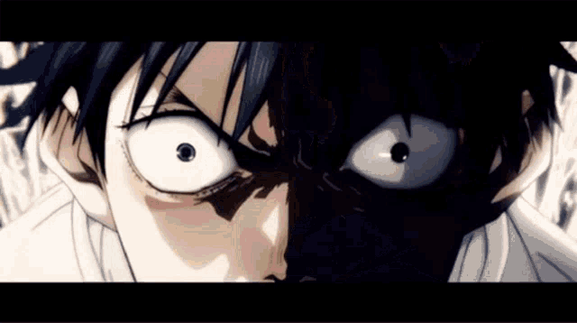 a close up of a person 's face with a very angry look on their face .