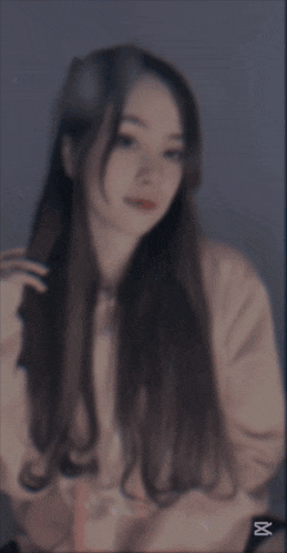 a blurred image of a woman with the caption cap cut