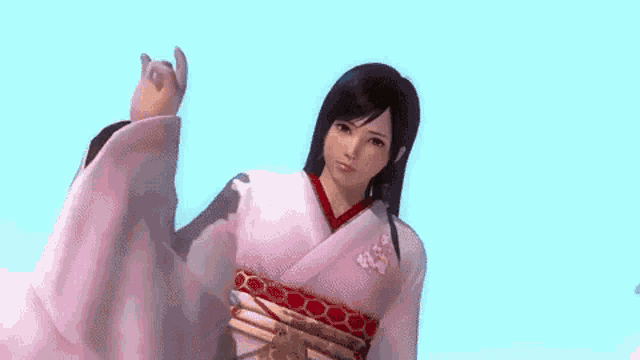 a woman in a pink kimono is waving her hand at the camera .