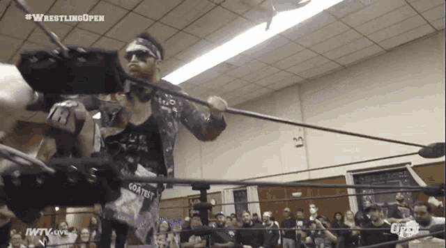 a man in a wrestling ring with the words wrestling open on the top