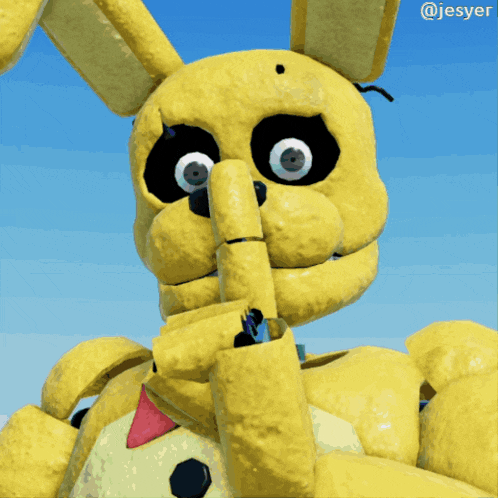 a close up of a yellow stuffed animal with the name jesyer on the bottom