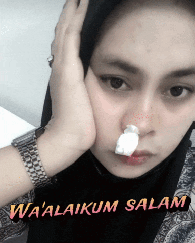 a woman with a napkin in her nose and the words wa'alaikum salam