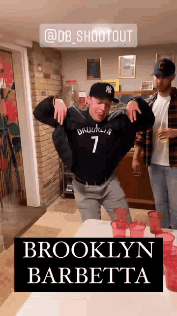 a man wearing a brooklyn 7 jersey is dancing