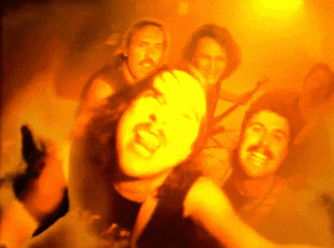 a group of people are posing for a picture and one of them has a beard