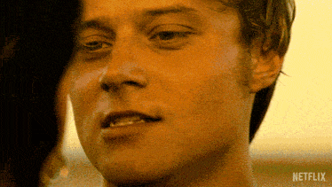 a close up of a man 's face with the word netflix on the bottom right