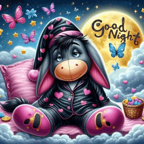 a stuffed donkey is sitting on a pillow with the words " good night " written on it