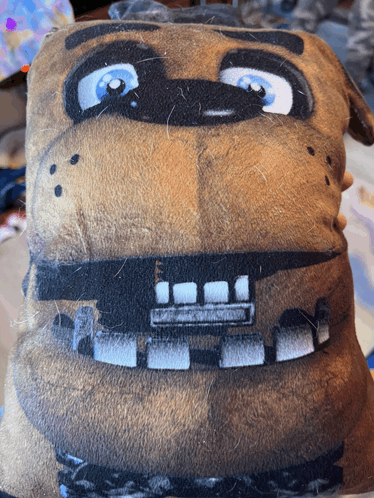 a close up of a stuffed animal that looks like freddy fazbear