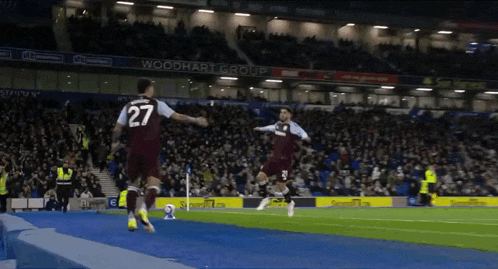 a soccer player with the number 27 on his shirt is running on the field