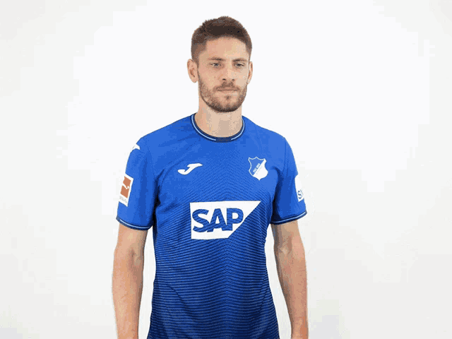 a man in a blue shirt with the word sap on the front